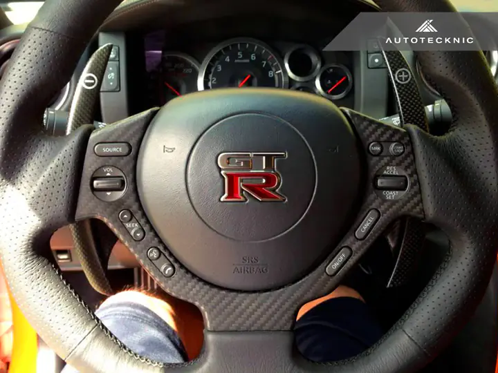 AUTOTECKNIC DRY CARBON FIBER STEERING WHEEL TRIM – NISSAN R35 GTR